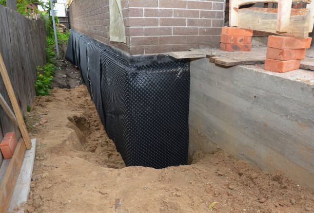 SJ Waterproofing Pros technician performing targeted Waterproofing assessment in Perry, MI